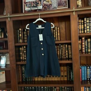 Navy blue romper, polyester with a rayon lining. M